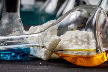 Glass bulbs with chemicals on the background of coagulants