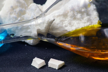 Glass bulb with chemicals on the background of coagulants