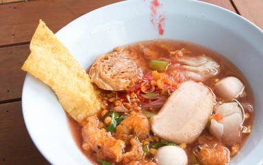 Pork meatballs and steam fish in noodle soup