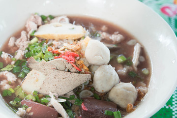 Pork meatballs and steam fish in noodle soup