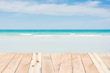 Fototapeta premium Wood terrace on beach blue sky