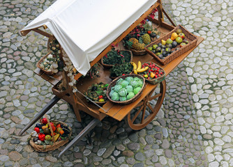 cart with fruits and vegetables for sale 