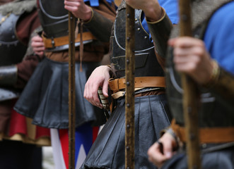 soldiers with medieval uniforms with the old weapons in hand
