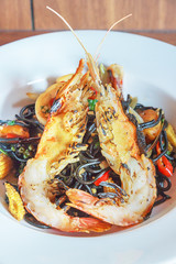 Fresh black pasta with seafood