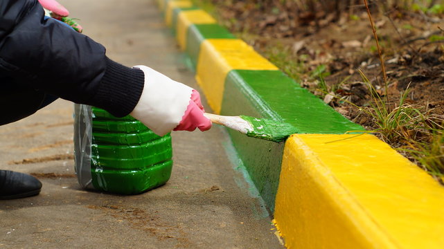 Painting Of The Road Curb At Schoolyard