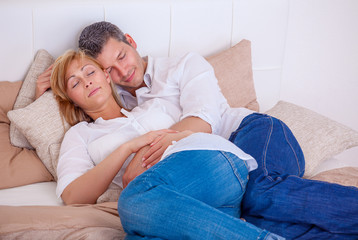 bed laying couple