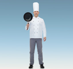 happy male chef cook holding frying pan