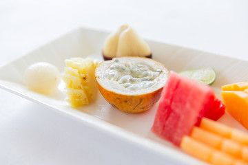 plate of fresh juicy fruit dessert at restaurant