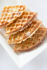 close up of waffles on plate at breakfast table