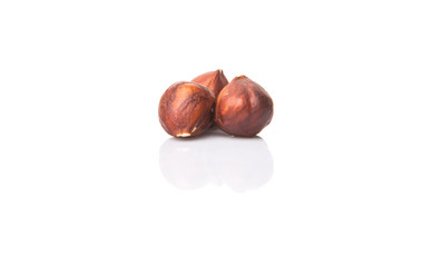 Hazelnuts over white background