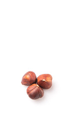 Hazelnuts over white background