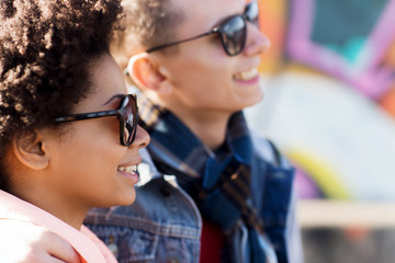 happy teenage friends in shades outdoors