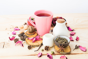 Tea cups with teapot on old wooden table