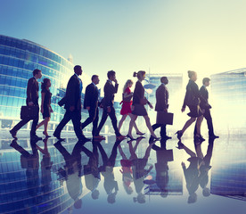 Group of Business People Walking Back Lit Concept