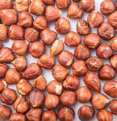 Hazelnuts over white background