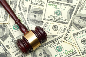 gavel on dollar background
