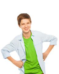Cute young teen boy smiling with hands on waist 