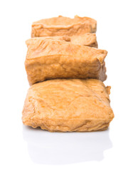 Homemade fried tofu over white background