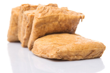 Homemade fried tofu over white background