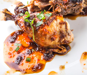 Roasted chicken piece coated with soy sauce
