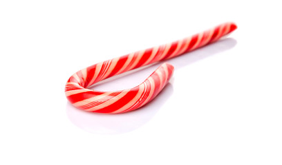 Christmas red and white stripe candy cane over white background