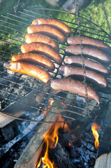 Grilled sausage and blood sausage on a traditional bonfire