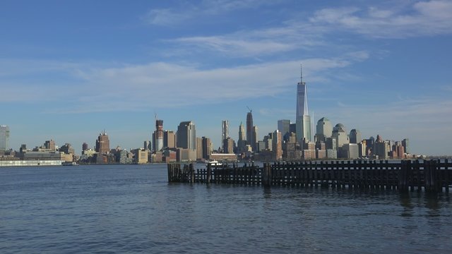 Old wooden pier of Hoboken Ferry Terminal with Manhattan on bkg