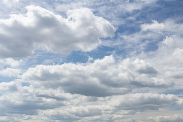Naklejka na ściany i meble Blue sky is full of huge white clouds