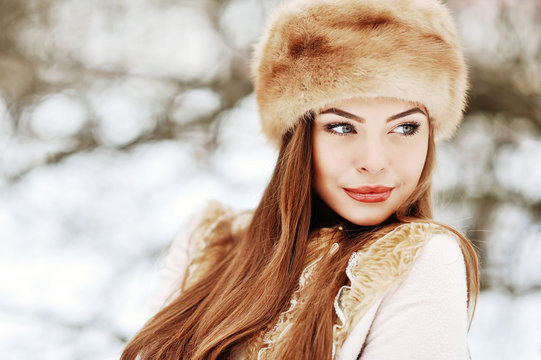 Portrait of young beautiful girl in winter