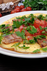 Omelet  bacon slices, tomatoes with herbs