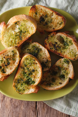 toast with fresh herbs and garlic on plate. vertical top view 

