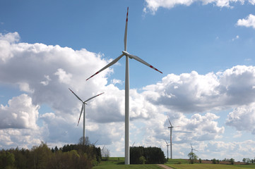 wind turbine landscape blue sky green grass