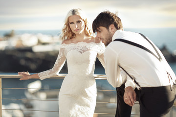 Young beautiful marriage couple in the exotic place