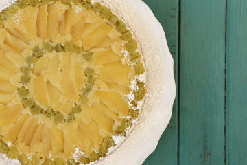 Rhubarb Apple Vanilla Cake on White Plate Turquoise Background