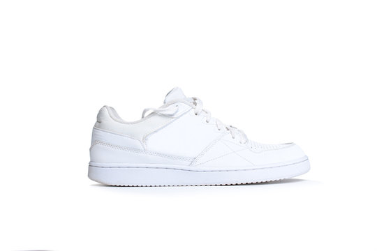 one white sneaker on a white background
