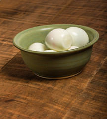 Bowl of peeled hard boiled eggs