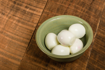 Bowl of peeled hard boiled eggs
