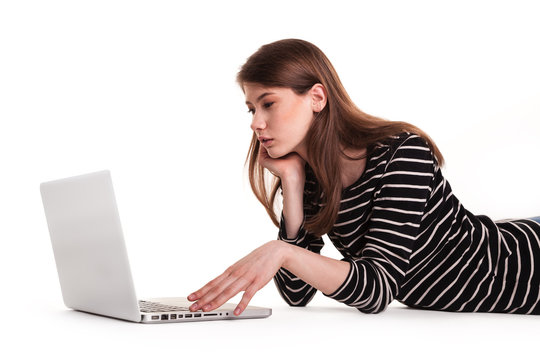 Young Thinking Woman with PC on Floor E-commerce Stock Image