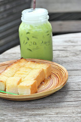 Bread, butter, topped milk and green tea.