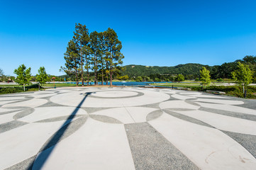 Geometric patterns in plaze next to lake