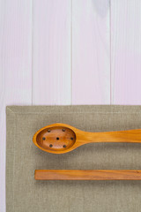 Kitchenware on beige towel
