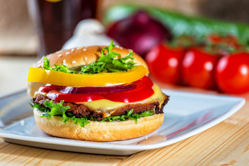 hamburger and drink with slice of lemon