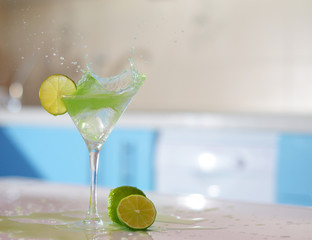 splash in glass of margarita