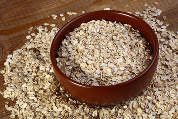 Oatmeal in plate and on the table