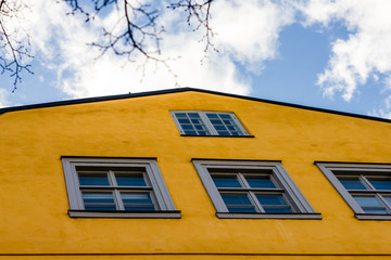 Old-style yellow wall with windows
