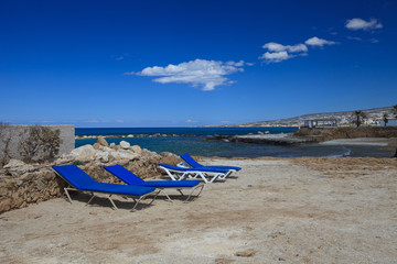 Fototapeta na wymiar comfortable chaise longues on the beach near the sea. 