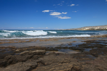 Fototapeta na wymiar The rocky coast and beautiful waves in Cyprus