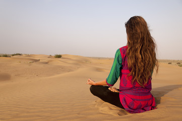 Young female practising yoga meditation in Jaisalmer, India
