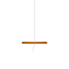 Wooden swing hanging on white rope