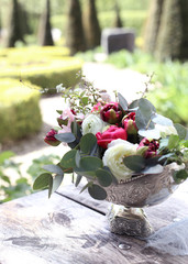 Fresh flowers decoration in a silver vase
